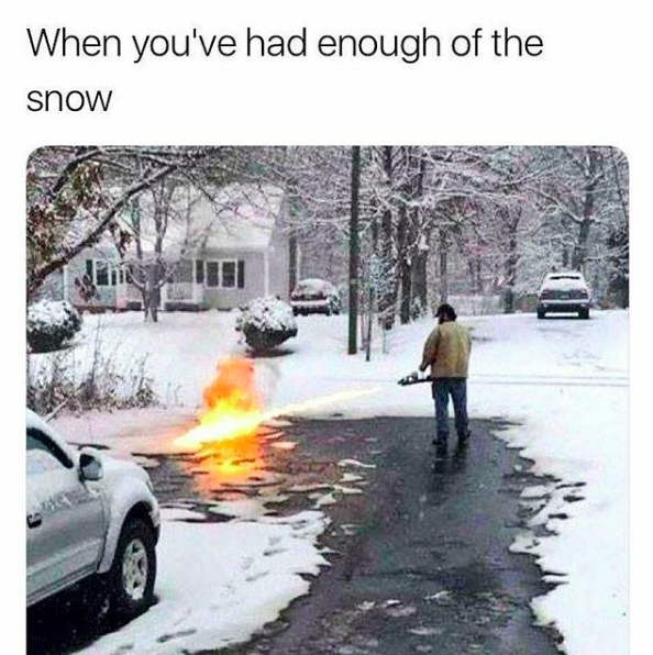 when you've had enough of the snow: man blowtorching snowy yard