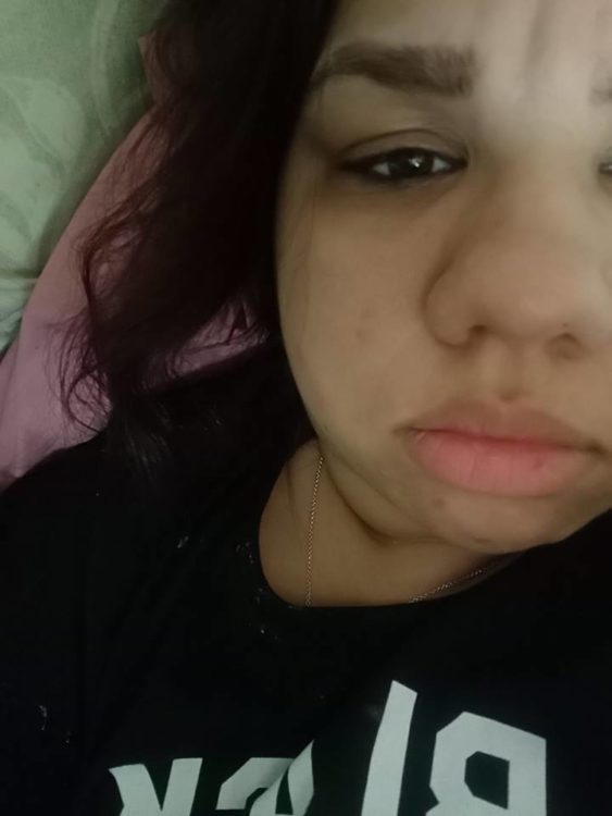 woman crying selfie in bed