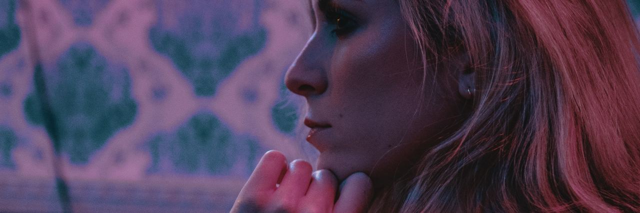 How to Stop Ruminating for Your Mental Health photo of woman with long blonde hair lost in thought