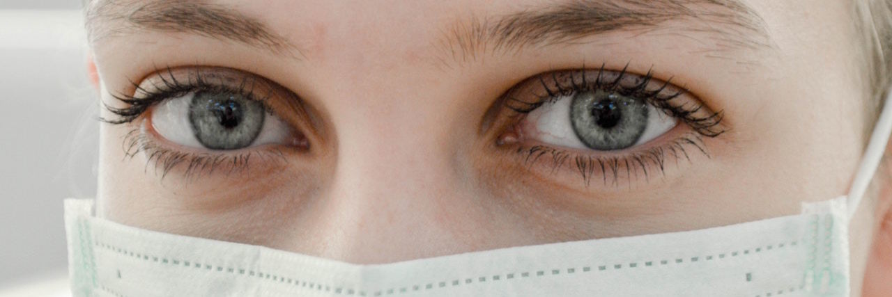 close up of a doctor with a face mask