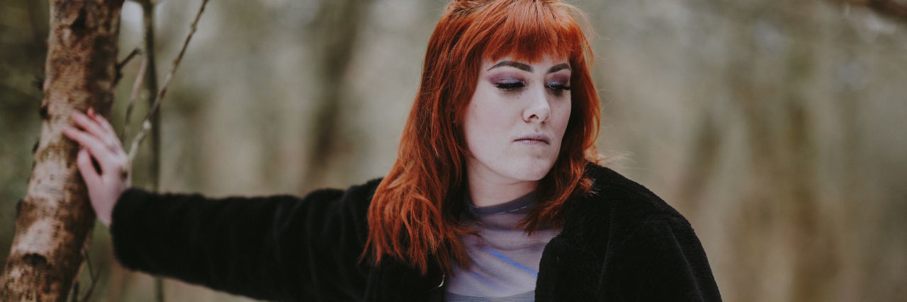 Clinicians Need to Be Educated About Borderline Personality Disorder woman leaning on tree angry expression