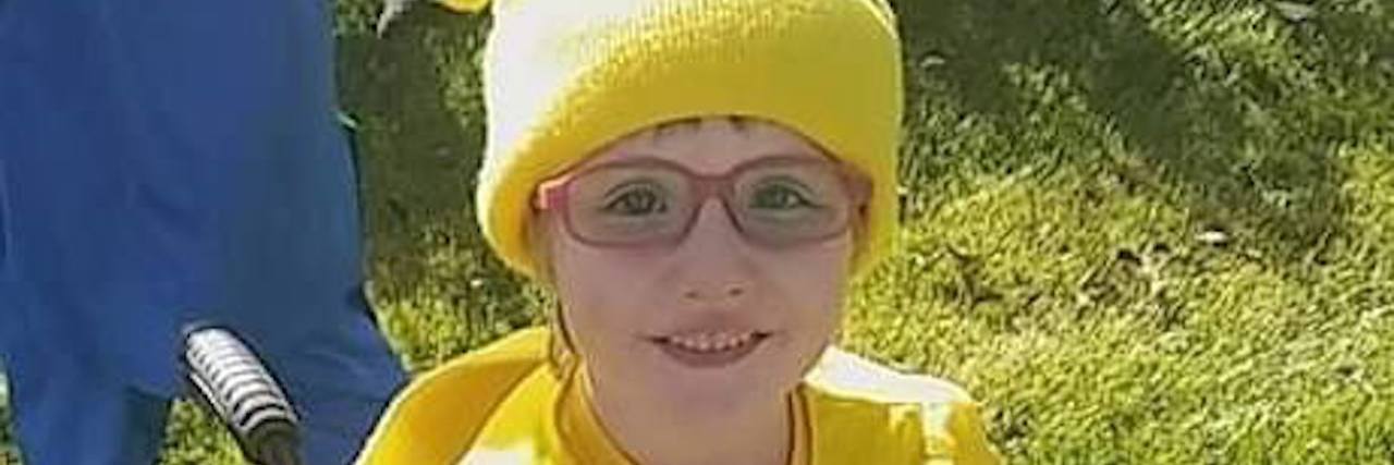 Please Stop Asking This Question About My Child With a Disability Little girl sitting on her wheelchair dressed in yellow costume.