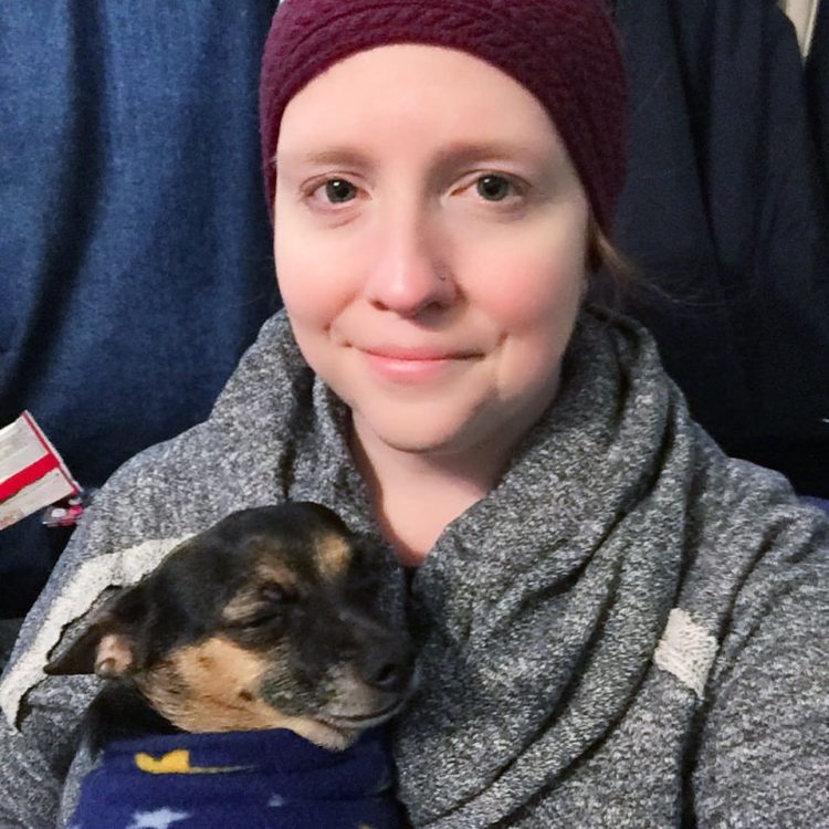 The author with her hat and holding her dog