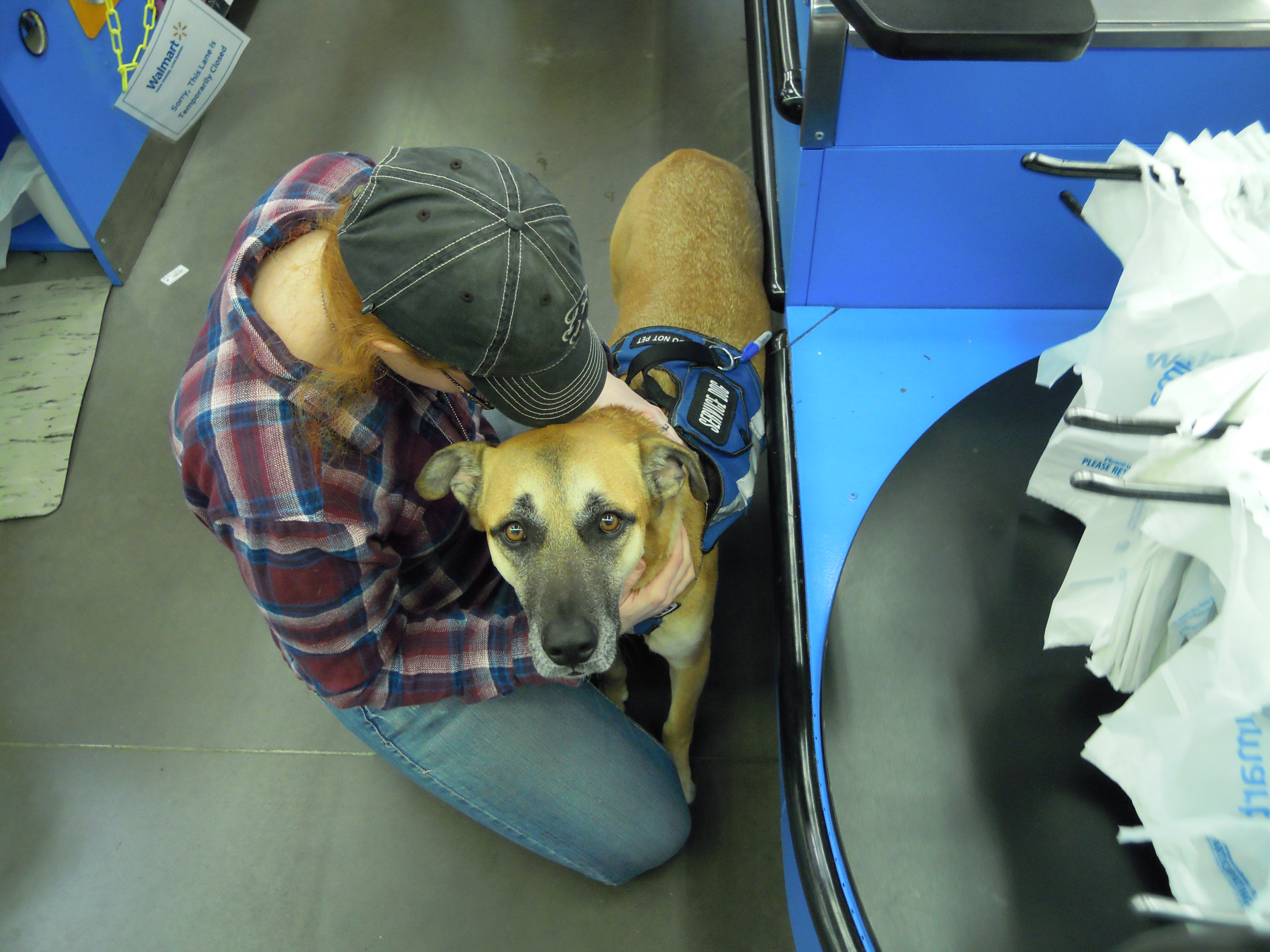 Sally getting help with sensory overload from her service dog.