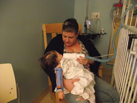 Tabitha caring for her child at hospital