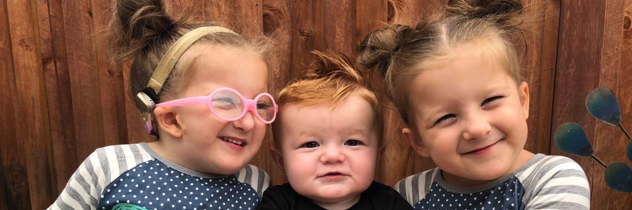 The Challenges of Parenting a Medically Complex Child The author's three children smiling and hugging each other