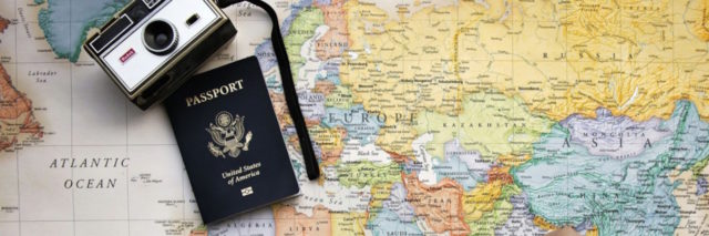 map, passport and camera