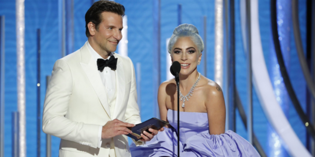 'A Star Is Born,' 'Sharp Objects' Take Home Awards at the Golden Globes Bradley Cooper in a white tux and Lady Gaga in a light blue gown on the stage at the Golden Globes
