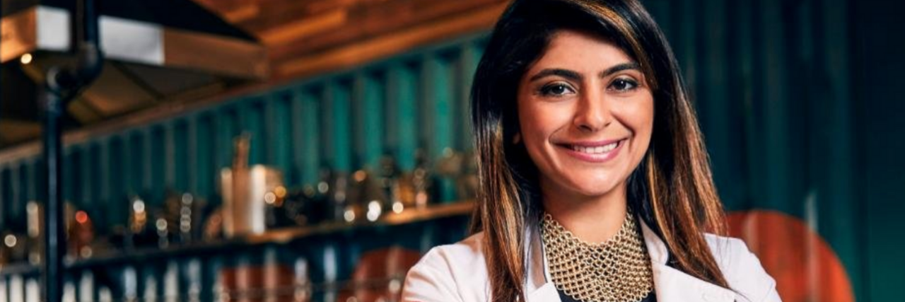 Fatima Ali smiling, wearing 'Top Chef' jacket
