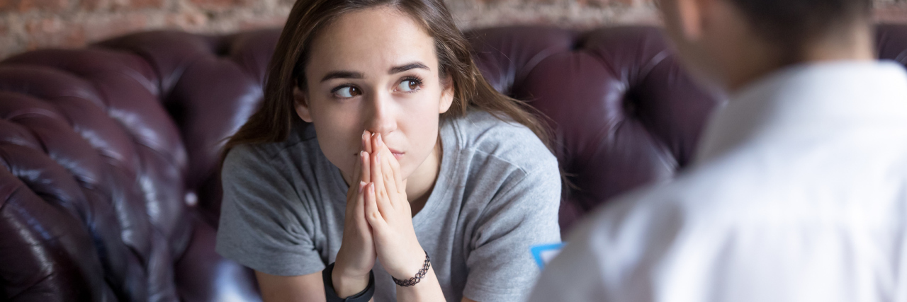 How Trauma-Informed Therapy Helps You Heal Young woman visiting therapist counselor