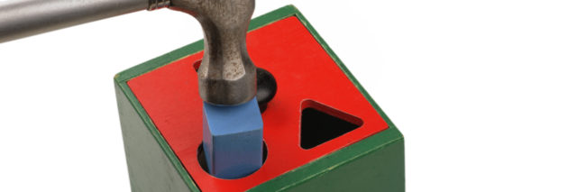 Forcing a square peg in a round hole with a hammer.