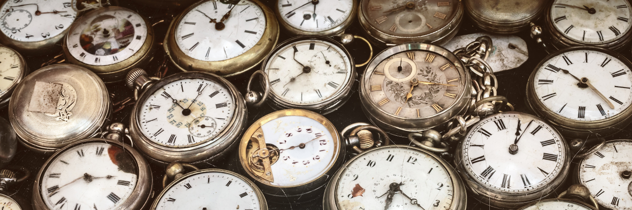The Time It Takes to Live With Chronic Illness Large pile of antique pocket watches.