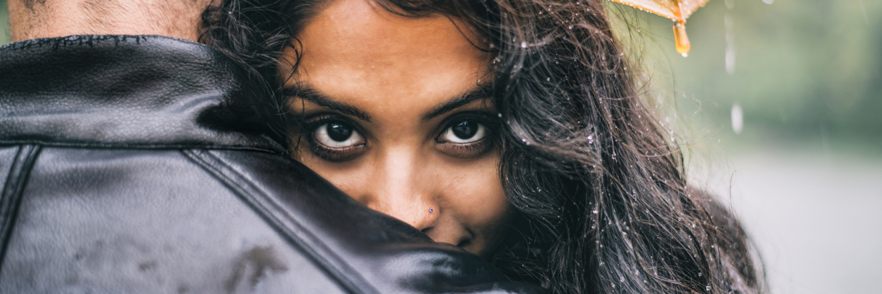 photo of couple, the woman south asian, looking into camera