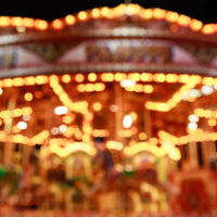 blurred merry-go-round lit up at night