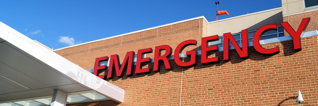 Deciding to Go to the Emergency Department With Chronic Illness A red Emergency sign marks the entrance of a hospital emergency department