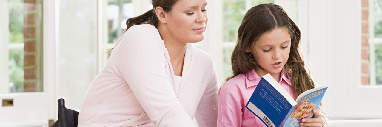 To the Parents of My Autistic Students, From Their Disabled Teacher Woman in wheelchair reading with child.