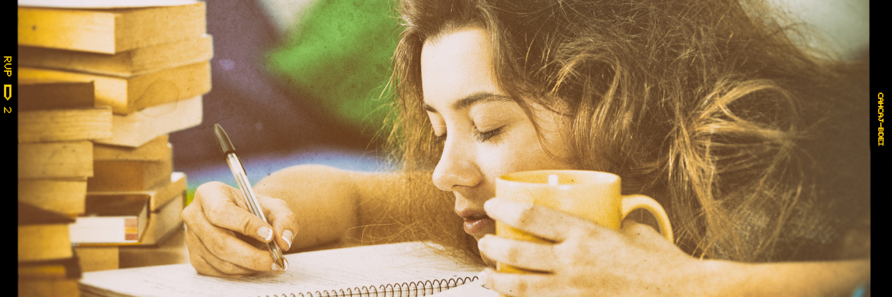 Research and Reality in My Life With Narcolepsy Tired woman trying to study.