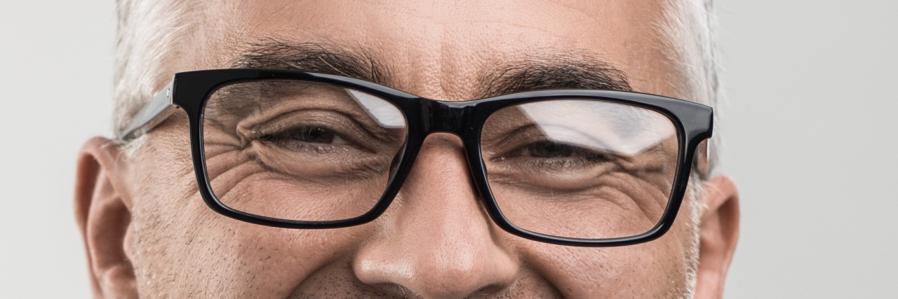 Close-up of man wearing glasses.
