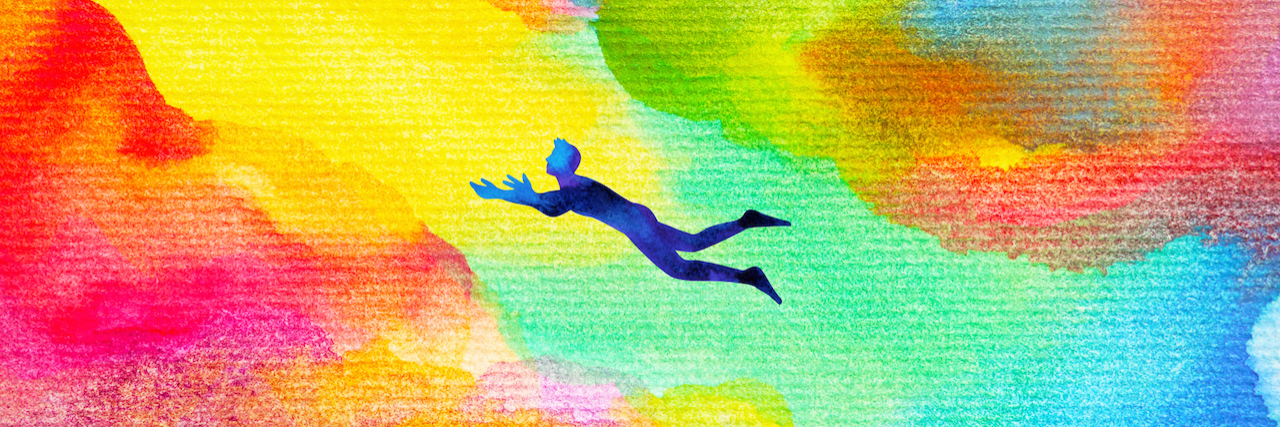 Advice for People Newly Diagnosed With Dissociative Identity Disorder man flying in abstract colorful dream universe