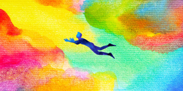 man flying in abstract colorful dream universe