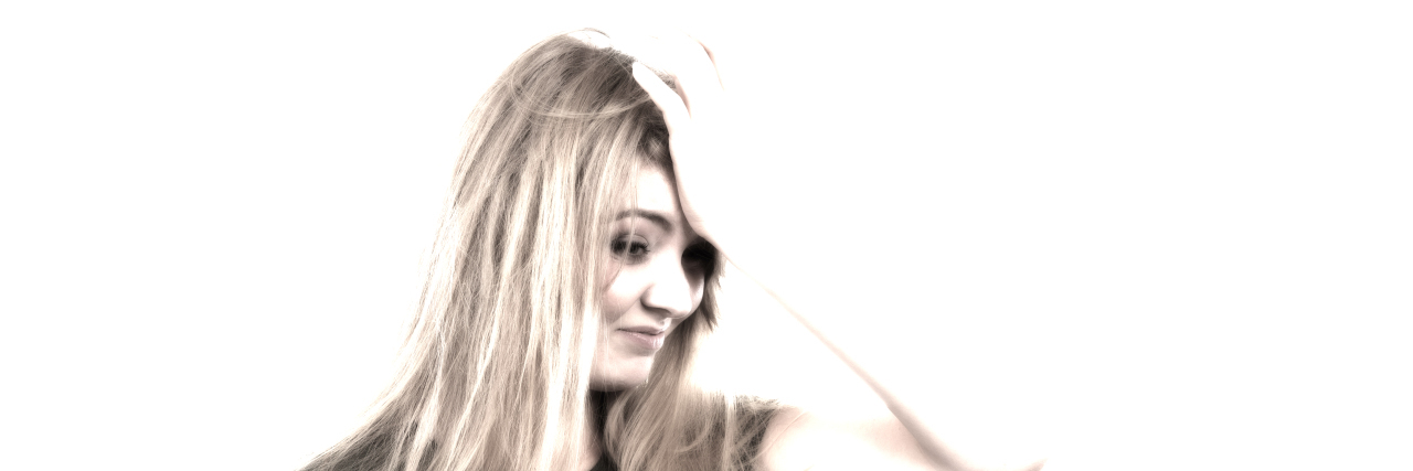 Annoying Things People Say About Rheumatoid Arthritis Frustrated woman with her hand on her forehead.