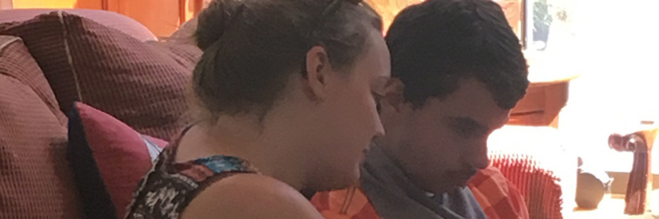 How Labeling Children 'Low Functioning' Limits Them Janet's son sitting on the sofa.