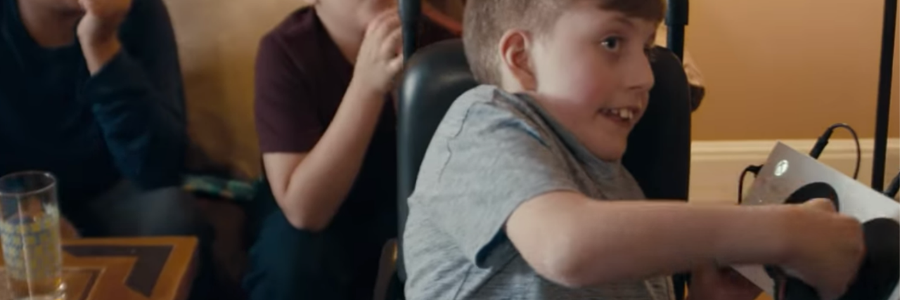 Microsoft Highlights Xbox Adaptive Controller in Super Bowl Commercial Owen playing with the Xbox Adaptive Controller while his friends watch.