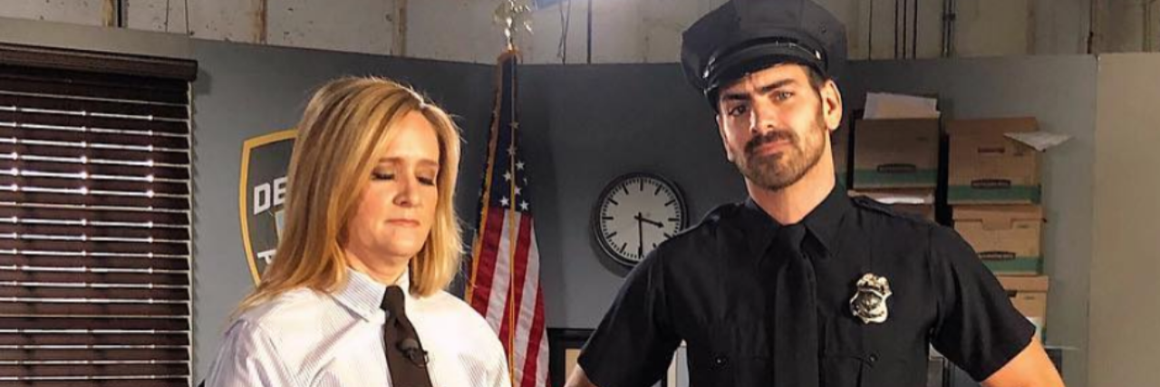 Nyle DiMarco Discusses Deaf Interactions With Police on 'Full Frontal' Samantha Bee in a white shirt and tie with Nyle DiMarco in a police uniform.
