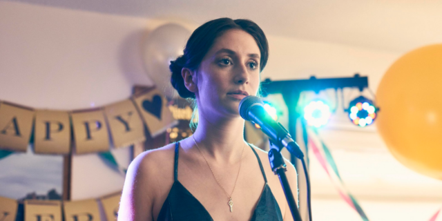 U.K. Channel 4 Airs Series Based on Memoir about "Pure" OCD Charly Clive as Marnie in "Pure." She's wearing a blue crushed velvet dress.