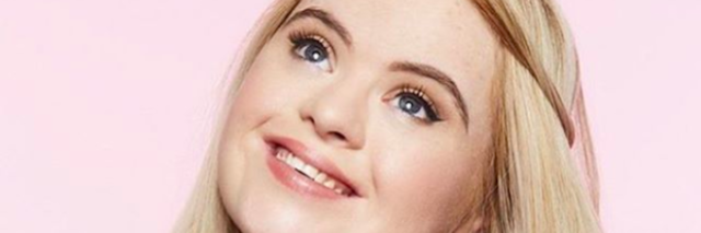 Model With Down Syndrome Kate Grant Is the New Face of Benefit Cosmetics Image of Kate Grant holding Benefit's eyeliner