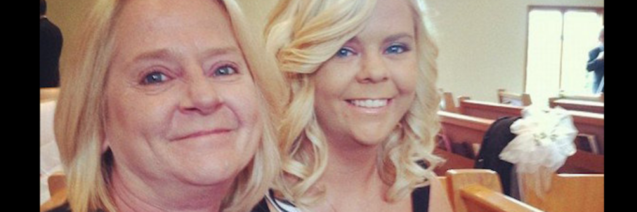 Thank You to My Mom, Who Raised a Disabled Daughter The author and her mom sitting next to each other on a Church pew. The mother is to the left, the author is to the right. They both have tan skin and blonde hair.