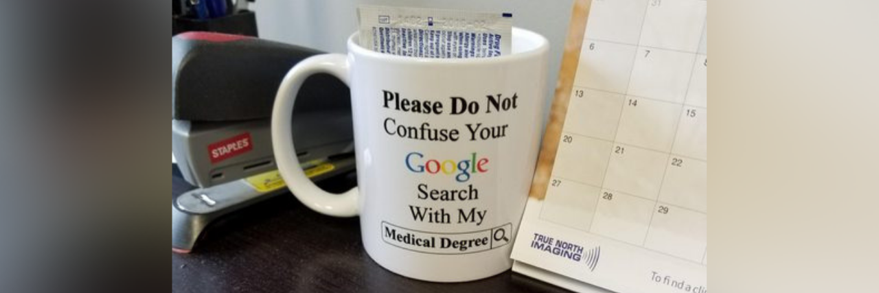 Reddit User Posts Photo of Problematic Mug in Doctor's Office a mug in a doctor's office that says "please do not confuse your google search with my medical degree"