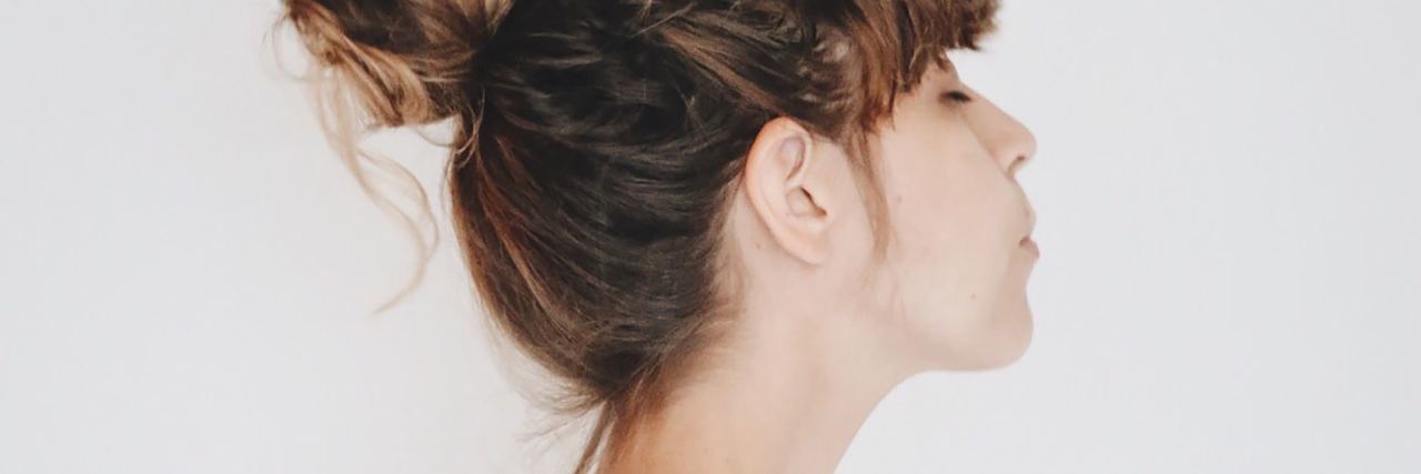 Failure to Recognize Adrenal Crisis Symptoms Is Causing Deaths photo of woman in profile on white background with eyes closed