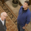 Larry David and Bob Einstein looking up at the ceiling in "Curb Your Enthusiasm"