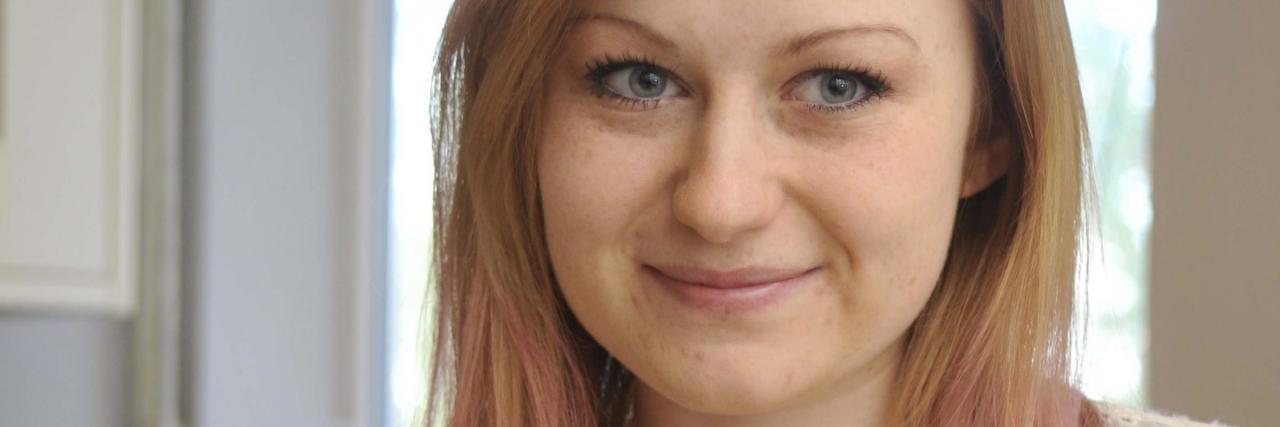 Is It OK to Miss Your Eating Disorder? photo of nicola davis posing with her eating disorder recovery cookbook