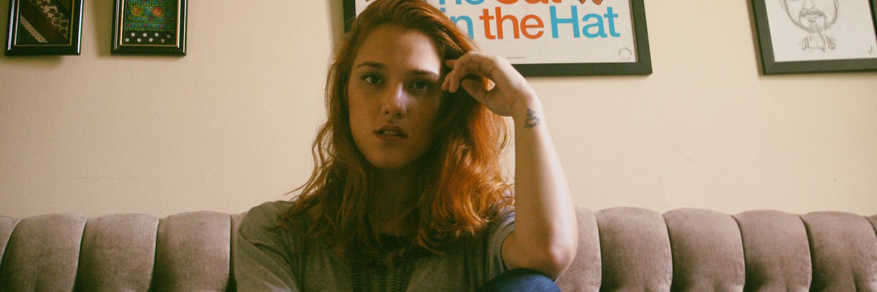 Feeling Shame for Having Bad Days as a Mental Health Advocate A woman sitting on the couch