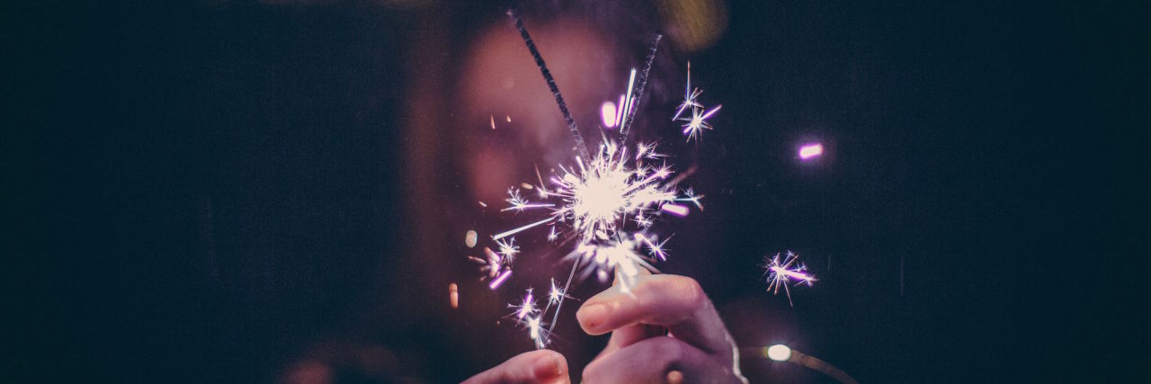 It's New Year's Eve and I Feel Suicidal woman with sparkler on new years