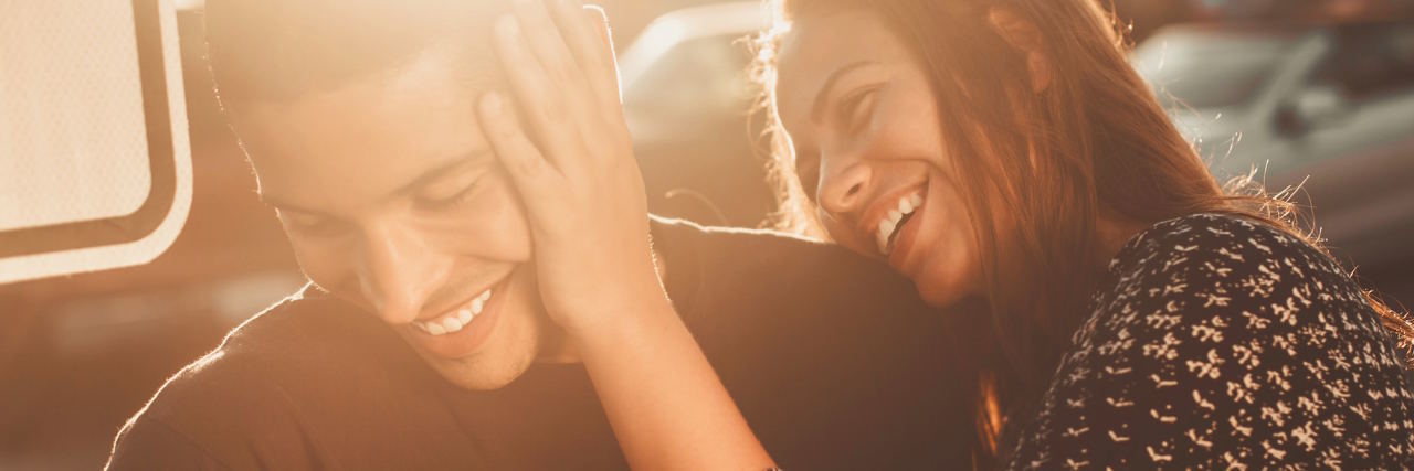 How Codependent Relationships Can Affect Your Mental Health couple smiling and laughing together