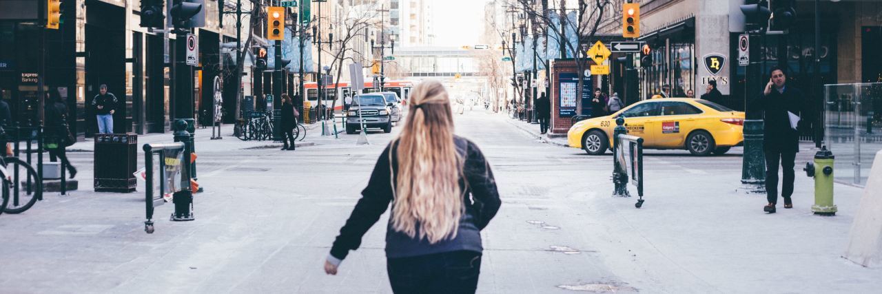My Trauma Therapist Recommended I Go Back to the Place of My Car Crash photo of woman standing in busy street