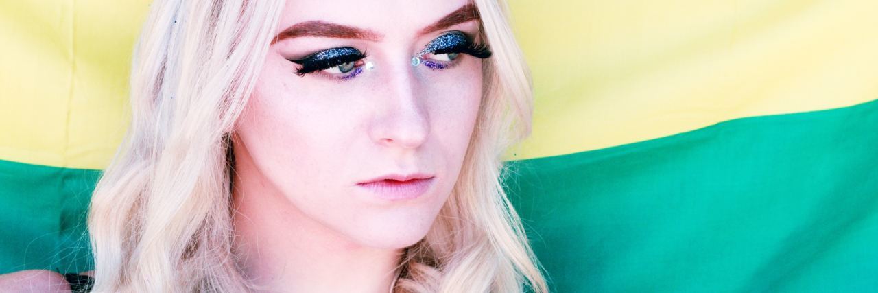 How BPD Unstable Identity Makes Me Question My Sexuality woman in front of flag