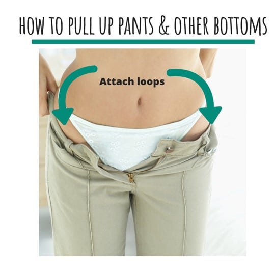 How to pull up pants, woman using loops to grasp pants.