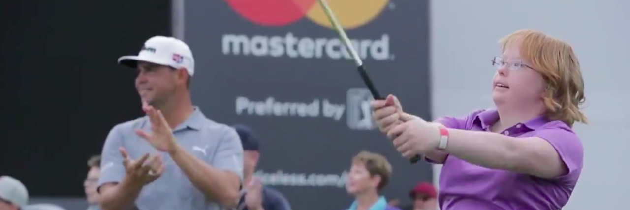 Amy Bockerstette, Golfer With Down Syndrome, Hits Par at Phoenix Open Screenshot of Amy swinging her golf club