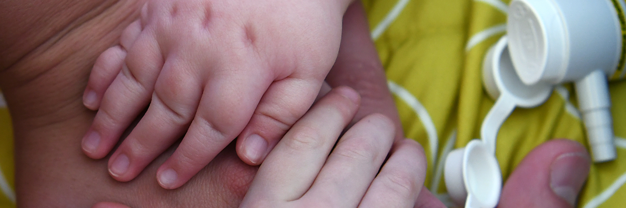Grieving the Loss of a Child: What It Feels Like The hands of a mother and her child