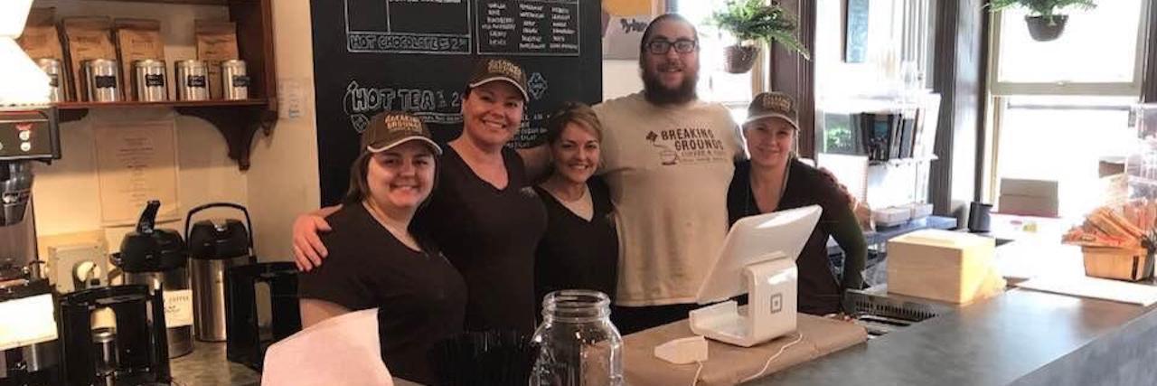 Breaking Grounds Coffee and Cafe employees behind the counter in the store