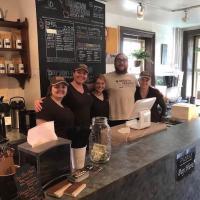 Breaking Grounds Coffee and Cafe employees behind the counter in the store