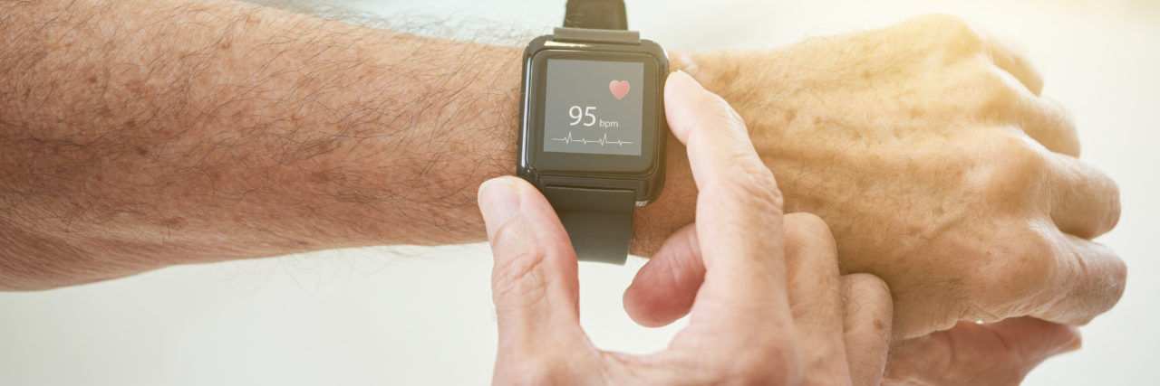 How You Can Get Involved During American Heart Awareness Month Crop shot of elderly man measuring pulse with modern smart watch in sunlight