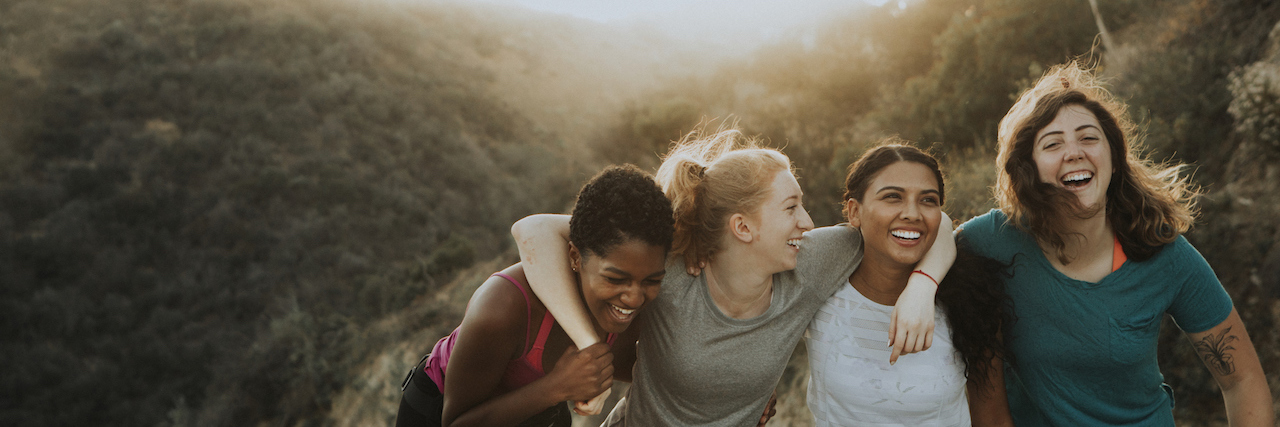 Mourning Lost Friendships While Making Space for New Ones Diverse group of friends laughing and hiking in the hills
