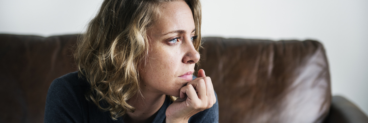 Stuck on a Couch and Struggling With Mental Illness A woman sitting on a couch