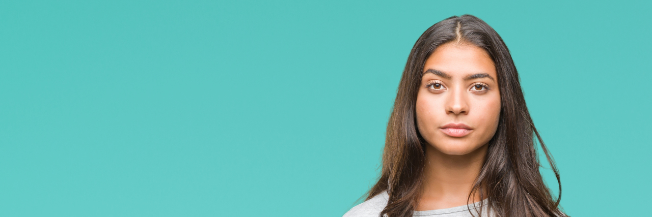 I Didn't Realize I Had an Eating Disorder Young Arab woman over isolated background with serious expression on face.