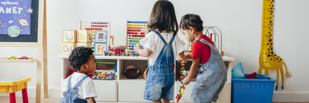 Parent Tips for Playtime With Autistic Children young children playing together in a playroom